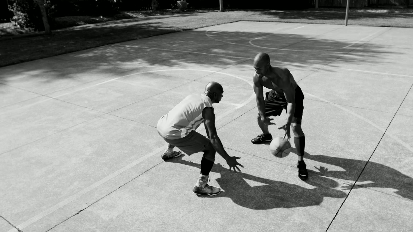 Two basketball players in a one-on-one game