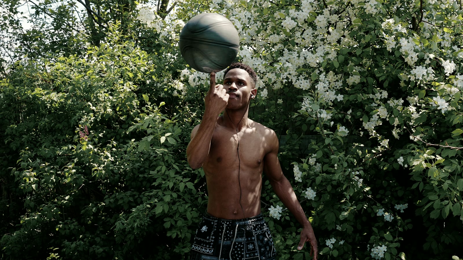 A basketball player focused on the ball before the next play